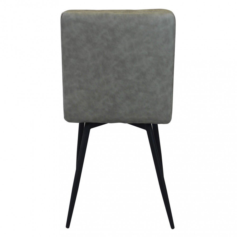 Sedia da interno sala da pranzo con struttura in metallo e seduta larga rivestita in ecopelle Ginter